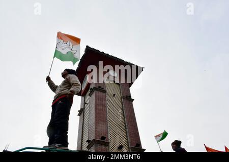 Srinagar, India. 29th Jan, 2023. Supporters of Indian National Congress hold party flags during a 'Bharat Jodo Yatra' march in Srinagar. Congress leader Rahul Gandhi resumed his 'Bharat Jodo Yatra' in Srinagar on Sunday, as the foot march entered its last day. Gandhi, along with his sister were joined by hundreds of Congress supporters, including women, who were seen carrying the tricolour and party flags. Credit: SOPA Images Limited/Alamy Live News Stock Photo