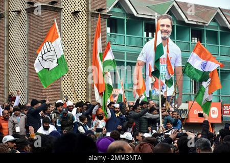 Srinagar, India. 29th Jan, 2023. Supporters of Indian National Congress hold party flags during a 'Bharat Jodo Yatra' march in Srinagar. Congress leader Rahul Gandhi resumed his 'Bharat Jodo Yatra' in Srinagar on Sunday, as the foot march entered its last day. Gandhi, along with his sister were joined by hundreds of Congress supporters, including women, who were seen carrying the tricolour and party flags. Credit: SOPA Images Limited/Alamy Live News Stock Photo