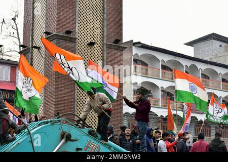 Srinagar, India. 29th Jan, 2023. Supporters of Indian National Congress hold party flags during a 'Bharat Jodo Yatra' march in Srinagar. Congress leader Rahul Gandhi resumed his 'Bharat Jodo Yatra' in Srinagar on Sunday, as the foot march entered its last day. Gandhi, along with his sister were joined by hundreds of Congress supporters, including women, who were seen carrying the tricolour and party flags. Credit: SOPA Images Limited/Alamy Live News Stock Photo