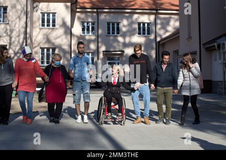 in this photo taken tuesday nov 13 2018 mahana jami 34 center dances with friends inside a government run camp for refugees and migrants in bosilegrad some 250 kilometers southeast of belgrade serbia as a little girl in a wheelchair in iran jami used to watch other children play on a slide and wondered why she couldnt do the same she then made a promise to herself to always dream big and never let her disability stand in the way ap photomarko drobnjakovic 2mm3the