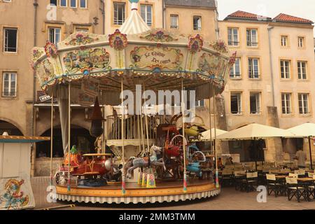 merry-go-round on square called Place Saint-Louis in french city Metz, France, August 30 2022 Stock Photo