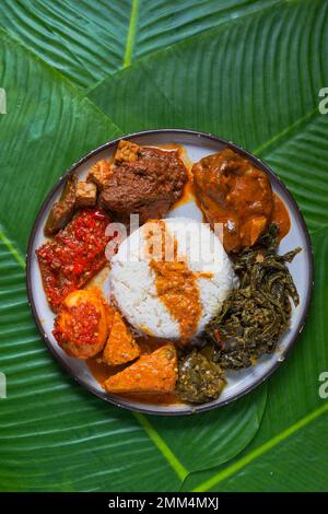 Famous traditional Indonesian food: Nasi Padang Stock Photo