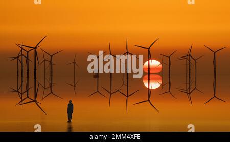 Antony Gormley’s iron figure stands on Crosby Beach at sunset, overlooking offshore wind turbines in Liverpool Bay. Stock Photo