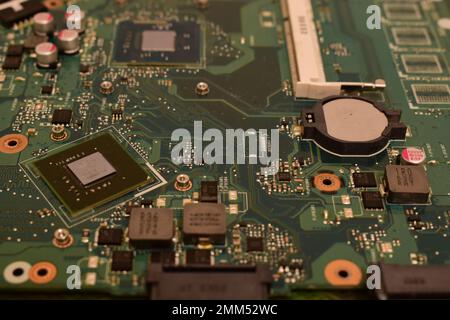 Green printed circuit board from an old Laptop that looks like a sci-fi city Stock Photo