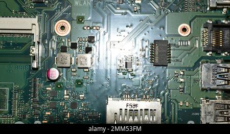 Green printed circuit board from an old Laptop that looks like a sci-fi city Stock Photo