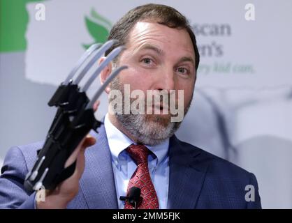 James Swartz, director of World Against Toys Causing Harm, holds ice  cream-scented Nickelodeon slime during a news conference unveiling the  organization's list of worst toys for the holidays, Tuesday, Nov. 19, 2019