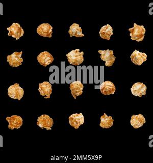 Caramelized popcorn isolated on black background. Popcorn is suitable for creating levitation effect and design. Stock Photo