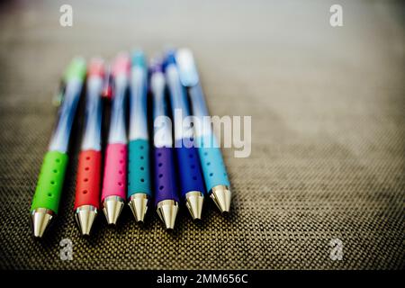 Colorful Pens Lined up on Table Stock Photo