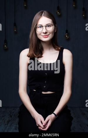 portrait of young confident happy woman in studio Stock Photo