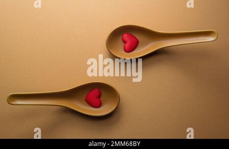 top view of two spoons with Red Hearts Stock Photo