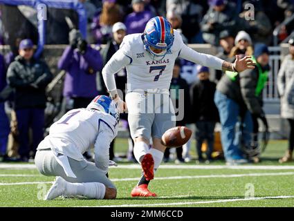 LAWRENCE, KS - SEPTEMBER 09: Central Michigan Running Back Kumehnnu Gwilly  (33) break through the tackle of Kansas Safety Bryce Torneden (1) during  the game between Central Michigan and Kansas on Saturday