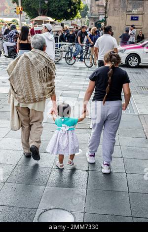 Mexico City,Historic Center centre,Historico Centro,Calle Monte de Piedad,holding hands,woman women lady female,adult adults,resident residents,child Stock Photo