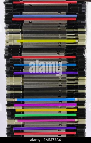 stack of many old magnetic floppy disks used to save data from the first personal computers Stock Photo