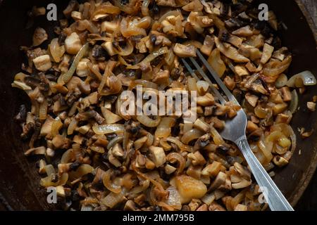 fried mushrooms in pans on a table in the kitchen on a table Stock Photo