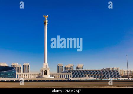 Kazakh Eli (The Country of Kazakhs) monument on Independence Square in Astana Kazakhstan with Palace of Independence seen in background Stock Photo