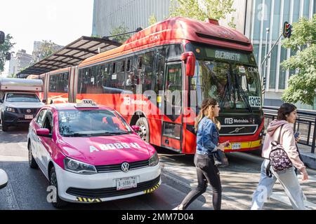 Mexico City,Avenida Paseo de la Reforma,traffic taxi cab taxicab,public bus Metrobus transportation,crossing busy street,woman women lady female,adult Stock Photo