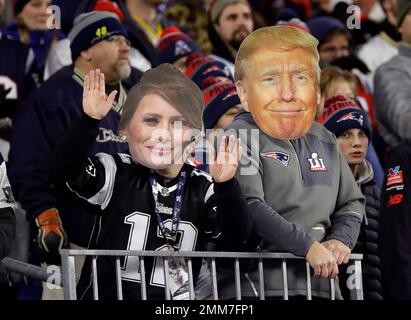 Green Bay Packers fans wear cheese hats while Buffalo Bills fans