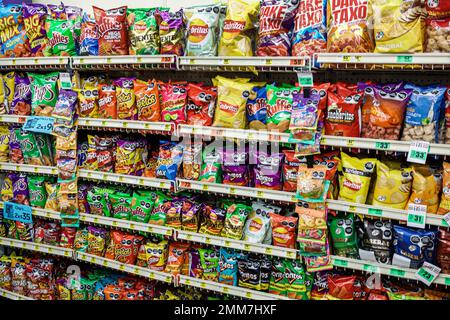 grocery store shelves with bags of Cheetos puffs on display Stock Photo ...