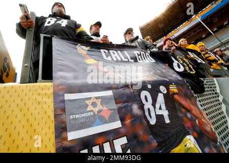 A Ravens fan in firefighter gear prays before the Pittsburgh Steelers play  the Baltimore Ravens at M&T Bank Stadium in Baltimore, Maryland on  September 11, 2011. UPI/Roger L. Wollenberg Stock Photo - Alamy