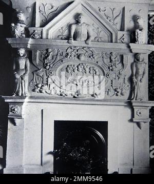 British pubs inns & taverns - A circa 1940 old photograph of a moulded plaster fireplace at the Luttrell Arms at Dunster., Somerset. Stock Photo