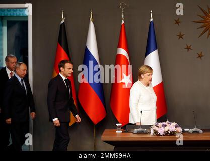 German Chancellor Angela Merkel, right, is followed by French President Emmanuel Macron, Russian President Vladimir Putin and Turkey's President Recep Tayyip Erdogan as they arrive for a news conference following their summit on Syria, in Istanbul, Saturday, Oct. 27, 2018. The leaders of Turkey, Russia, France and Germany were gathering for a summit Saturday in Istanbul about Syria, hoping to lay the groundwork for eventual peace in a country devastated by years of war. (AP Photo/Lefteris Pitarakis)