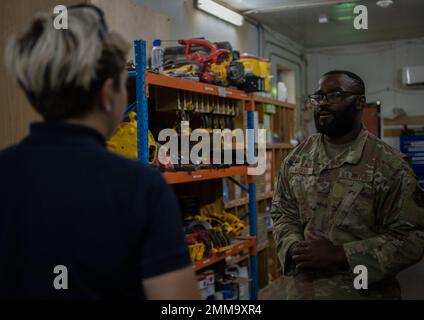U.S. Air Force Senior Airman Cameron Walker, 386th Expeditionary Civil Engineer Squadron inventory technician, helps a customer at the U-Fix It building on Ali Al Salem Air Base, Kuwait, September 15, 2022. The U-Fix It store supplies Airmen with anything they may need for self help projects around base. Ali Al Salem,Cameron Walker,DEPLOYMENT,ECES,Kuwait,U-fix it, Stock Photo