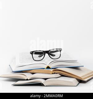 front view open books with glasses. Resolution and high quality beautiful photo Stock Photo