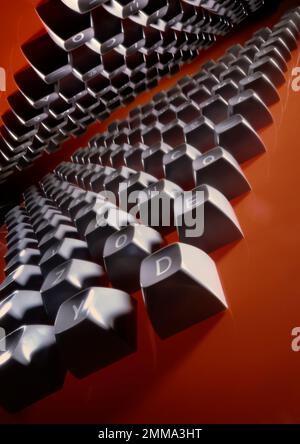 Computer keys in graphic, dramatic image, with vanishing point to the horizon.  Orange background in this studio photograph. Stock Photo