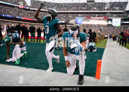 Philadelphia Eagles offensive players huddle up in a group as quarterback  Jalen Hurts (1) calls a play in the huddle during an NFL football game  against the Dallas Cowboys, Monday, Sept. 27