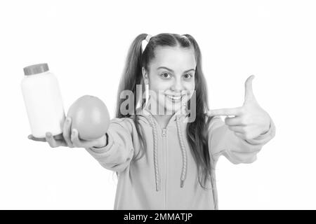 presenting vitamin product. child with orange flavored pill. effervescent tablet for kids. Stock Photo
