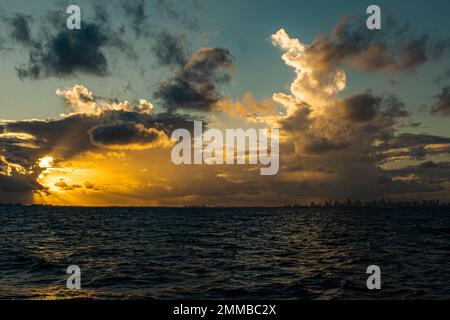 golden god rays over the Miami coast Stock Photo