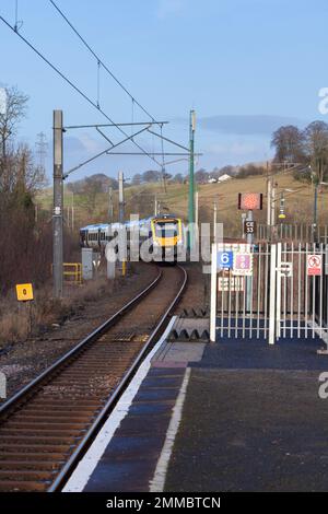 Northern Rail CAF class 195 train 195107 arriving  at Oxenholme the Lake District railway station with a Windermere branch train Stock Photo