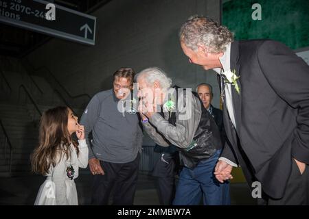 Don Maynard, left, and Joe Namath, center, joke with a member of Weeb  Ewbank's family during the Ring of Honor induction as the Jets faced  the New York Giants at the New