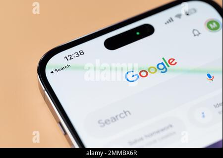 New york, USA - January 28, 2022: Using google search on iphone 14 pro in smartphone screen close up view Stock Photo