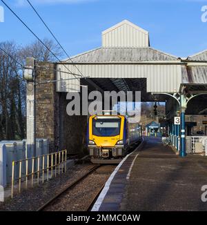 Northern Rail CAF class 195 train at Oxenholme the Lake District railway station waiting to depart with a Windermere branch train Stock Photo