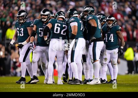 Philadelphia Eagles offensive players huddle during the first half