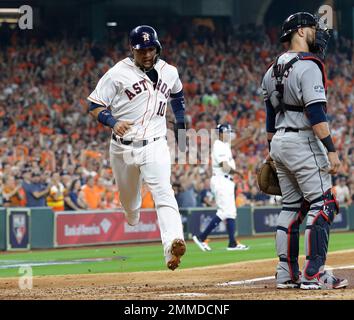 Houston Astros' Yuli Gurriel scores past Boston Red Sox catcher Christian  Vazquez on a sacrifice flay by Jose Altuve during the eighth inning in Game  1 of baseball's American League Championship Series