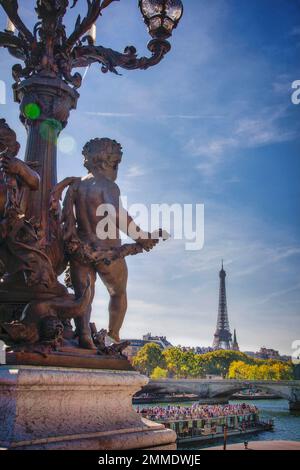 The Eiffel Tower and River Seine as seen from the decorated Pont du Alexandre III in Paris, France. Stock Photo