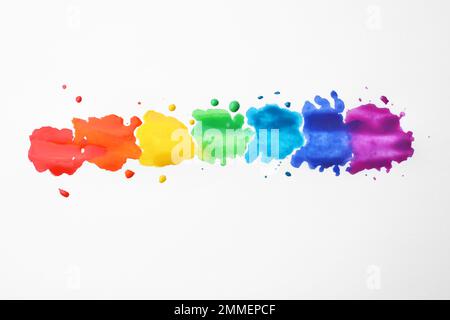 Rainbow drawing with watercolor paint on white paper, top view Stock Photo