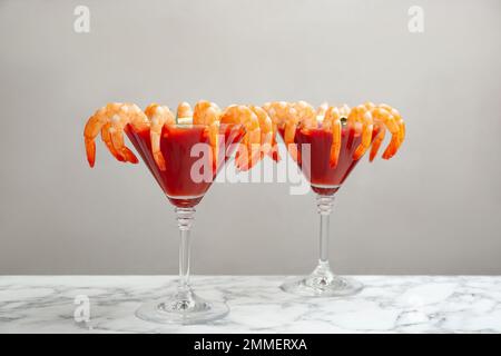 Shrimp cocktail with tomato sauce on marble table Stock Photo