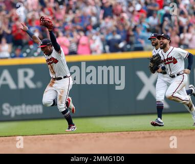 Atlanta Braves' Orlando Arcia, from left, Ronald Acuna Jr. and Dansby  Swanson celebrate after a baseball game against the Philadelphia Phillies,  Tuesday, July 26, 2022, in Philadelphia. (AP Photo/Matt Slocum Stock Photo 