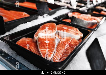 Steaks of fresh fish on ice in supermarket Stock Photo