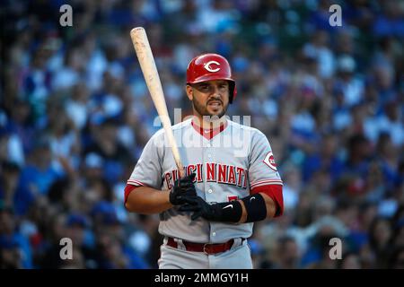 Cincinnati Reds' Eugenio Suarez (7) stands on third base with a triple as  Pittsburgh Pirates third baseman Sean Rodriguez, right, holds the late tag  during the eleventh inning of a baseball game