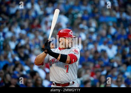 Cincinnati Reds' Eugenio Suarez (7) stands on third base with a triple as  Pittsburgh Pirates third baseman Sean Rodriguez, right, holds the late tag  during the eleventh inning of a baseball game