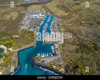 An aerial of Honokohau Small Boat Harbor, Kona's biggest harbor, with over 250 boat docks and several hundred more dry-docked boats, North Kona Distri Stock Photo