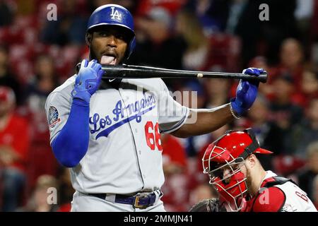 Cincinnati Reds' Yasiel Puig licks his bat after hitting a foul ball during  the fifth inning of a baseball game against the Milwaukee Brewers,  Saturday, June 22, 2019, in Milwaukee. (AP Photo/Aaron