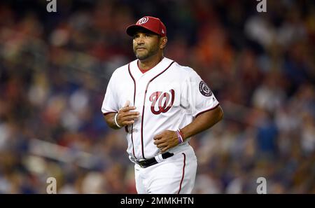 Washington Nationals manager Dave Martinez walks back to the dugout after a  pitching change during a baseball game against the Atlanta Braves early  Saturday, Aug. 14, 2021, in Washington. (AP Photo/Nick Wass