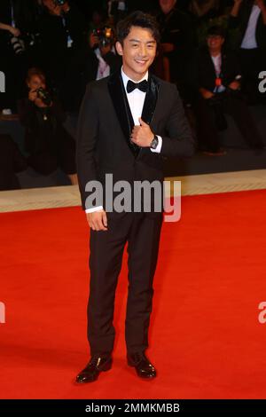 Actor Kai Zheng poses for photographers at the premiere of the film ...