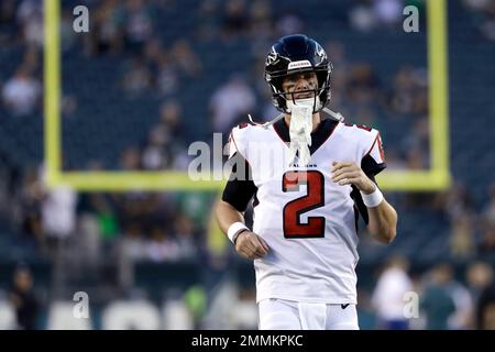 Atlanta Falcons quarterback Matt Ryan (left) walks of the field after  Chicago Bears defensive back Tashaun Gipson Sr. (Photo by top right)  intercepted his pass intended for Calvin Ridley for the turnover