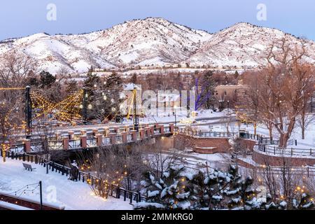 Christmas lights in winter, Golden, Colorado, USA. [Washington Avenue Bridge over Clear Creek.] Stock Photo